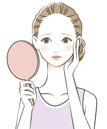手鏡で自分の顔を見つめる女性が描かれています。頬には赤みがあり、肌のトラブルに悩んでいる様子で、心配そうな表情をしています。