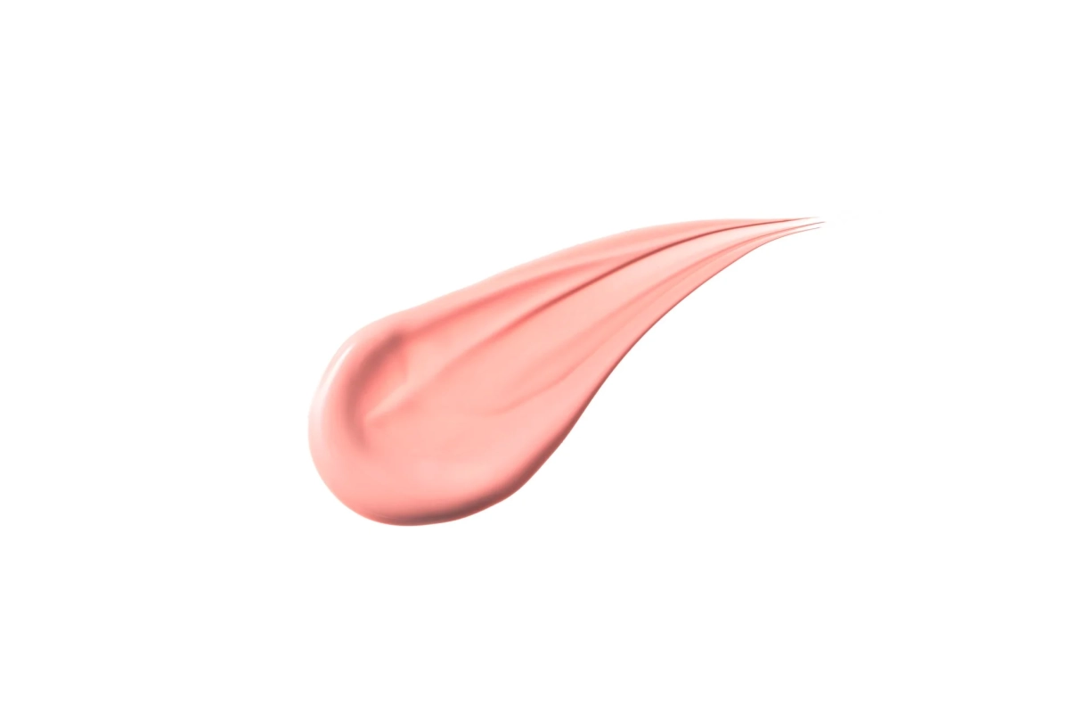 光沢のあるピンクがかったピーチ色の化粧品
