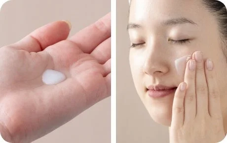 スキンケア製品を塗る女性の手