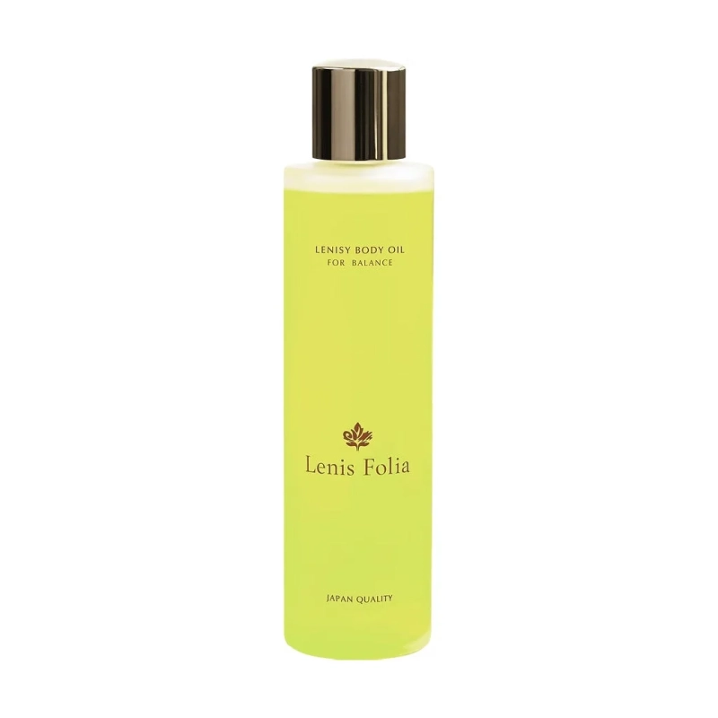 白背景に置かれた、薄緑色の液体が入った「LENISY BODY OIL FOR BALANCE」と書かれたボディオイルのボトルです。ゴールドのキャップとブランドロゴが特徴的です。